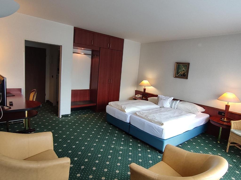 Postel nebo postele na pokoji v ubytování Condi Hotel