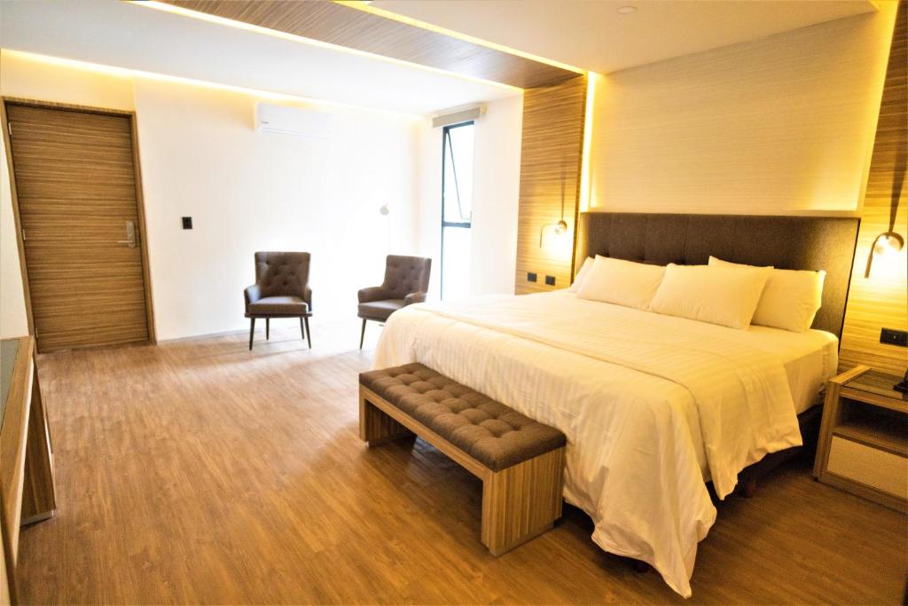 Postel nebo postele na pokoji v ubytování Hotel Plaza by Kavia