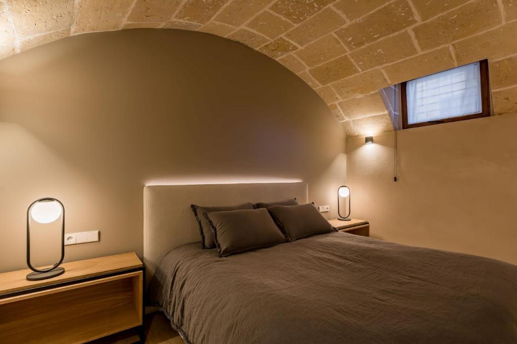 Postel nebo postele na pokoji v ubytování Hotel Can Cirera