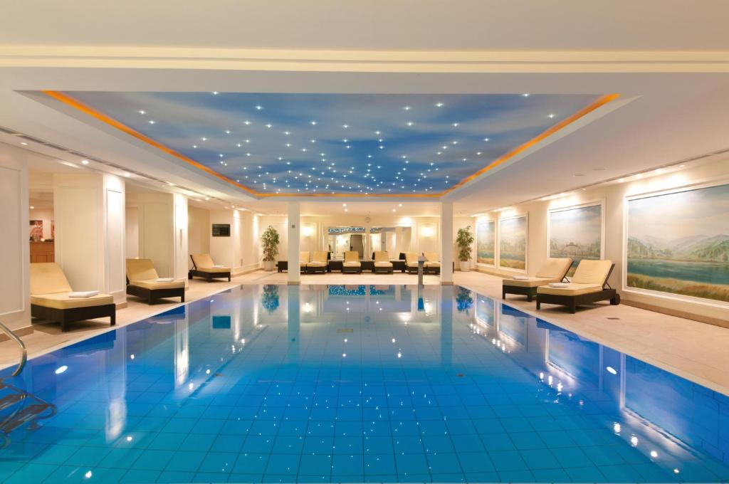 a hotel swimming pool with a star ceiling at Maritim Hotel Dresden in Dresden