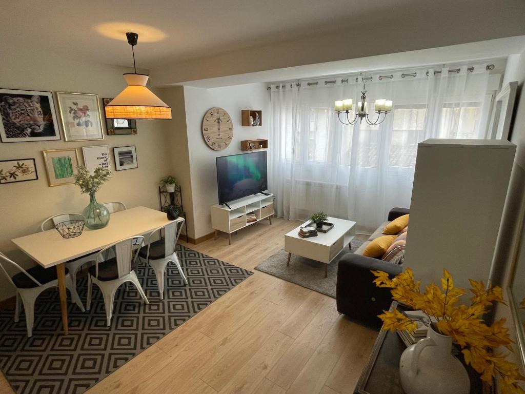 a living room with a couch and a table at San Agustin Centro in Logroño