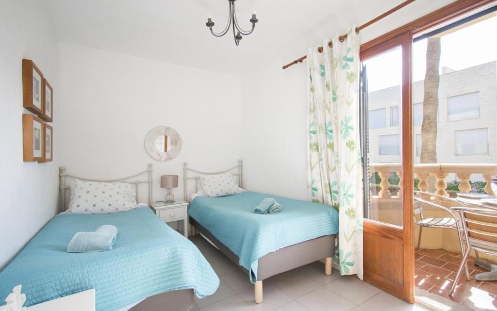 Posteľ alebo postele v izbe v ubytovaní Cosy Home with Pool ideal for Family & Sports near Beach in Port de Pollença