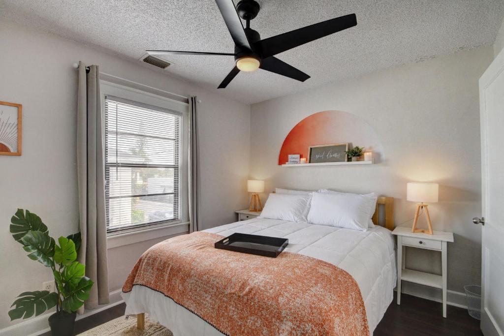 a bedroom with a bed with a ceiling fan at Cozy 1-bd oasis Downtown Lake Worth, 5 Star Amenities in Lake Worth