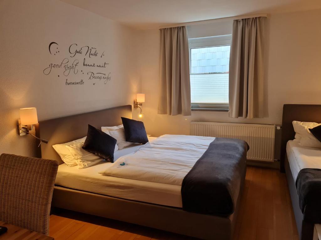 Postel nebo postele na pokoji v ubytování Hotel Herrenhof