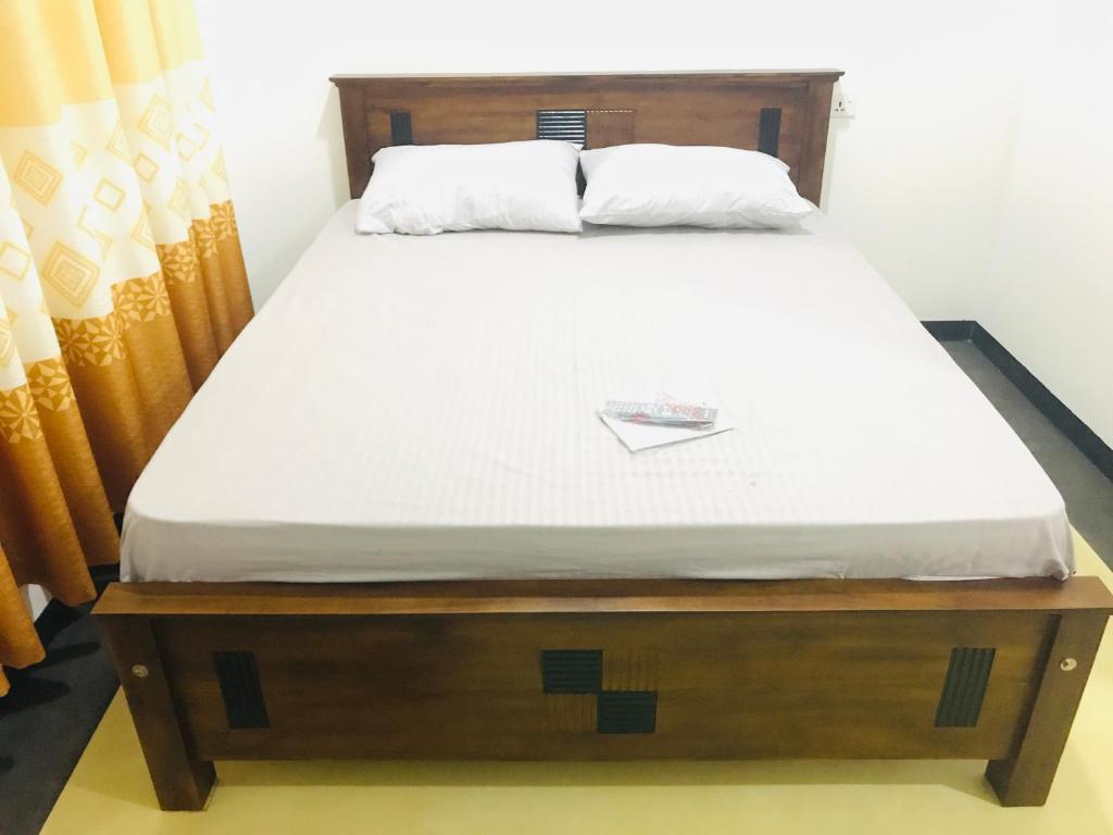 Postel nebo postele na pokoji v ubytování Hotel Ganthera Kataragama