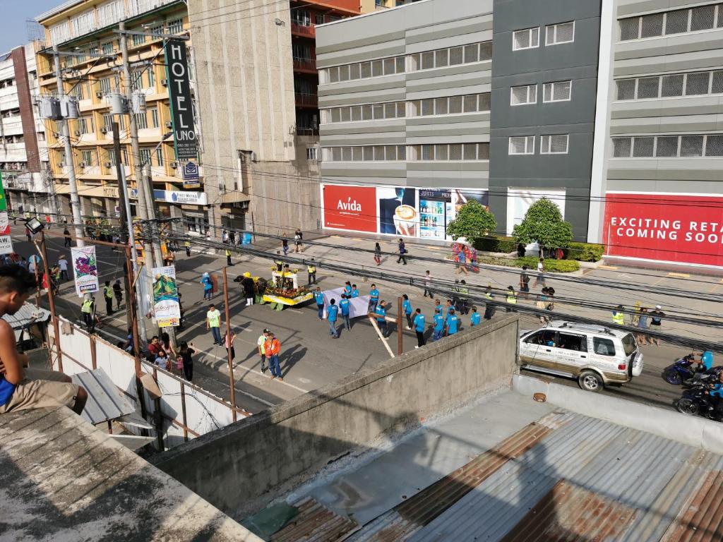 a group of people walking around in a city at Avida Davao Condos, downtown CM Recto Avenue, Davao City in Davao City