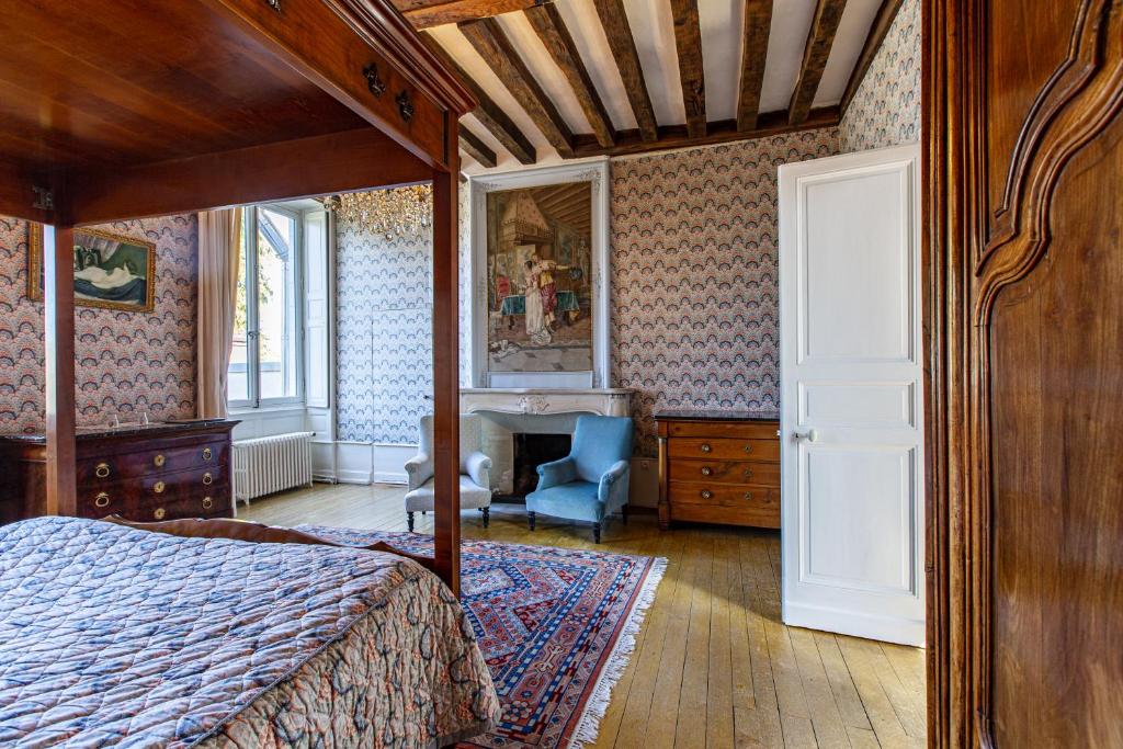 Postel nebo postele na pokoji v ubytování Manoir de la Voute maison d'hôtes