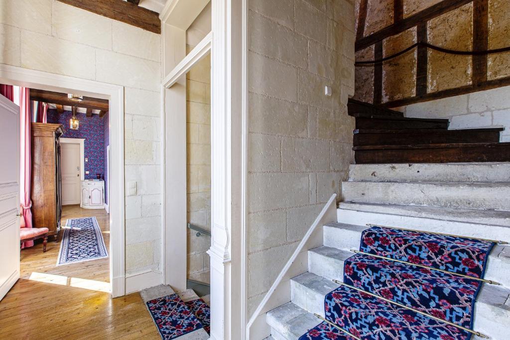Postel nebo postele na pokoji v ubytování Manoir de la Voute maison d'hôtes