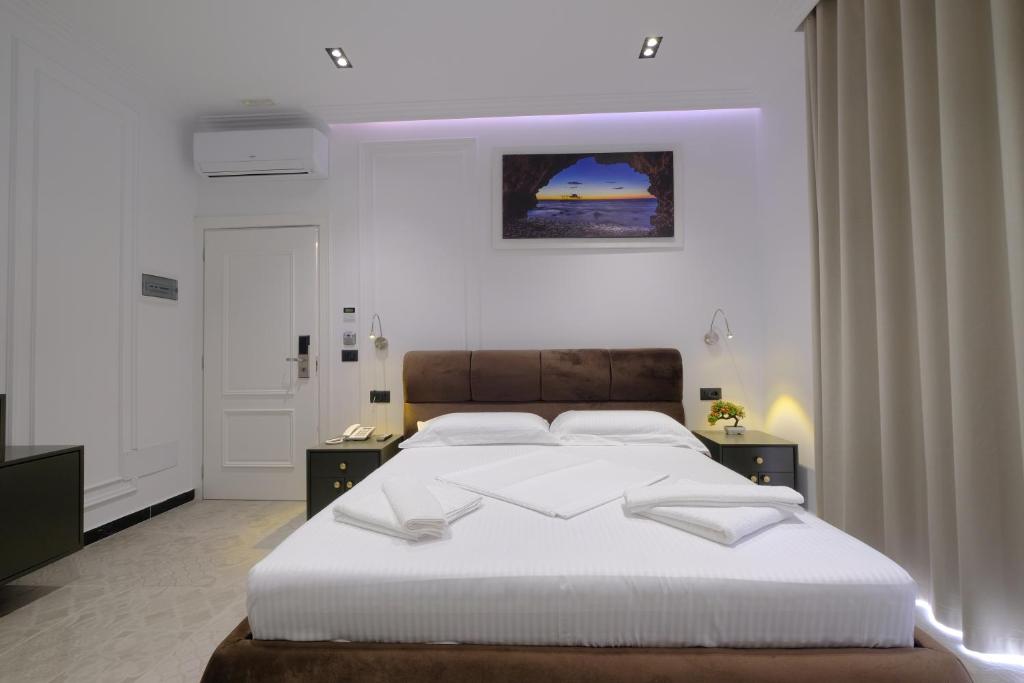 Postel nebo postele na pokoji v ubytování NOLEA Boutique Hotel
