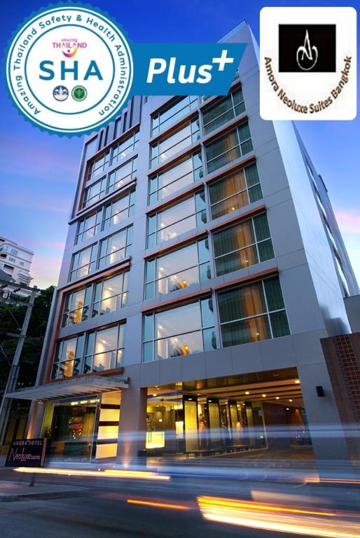 a building with a sign that reads sha plus at Amora NeoLuxe Suites Hotel in Bangkok