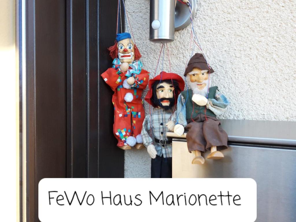 a group of christmas decorations hanging from a door at FeWo Marionette Hirschberg Lahn in Hirschberg
