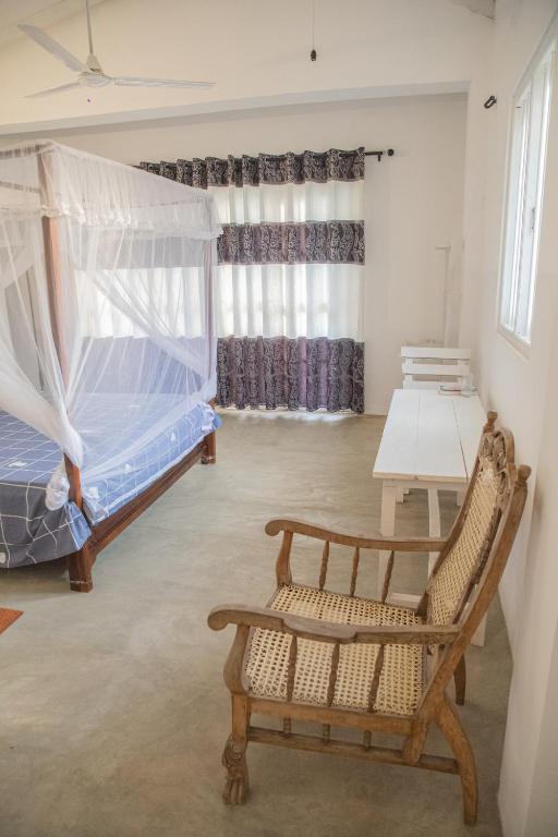 Postel nebo postele na pokoji v ubytování Kodi Beach Home