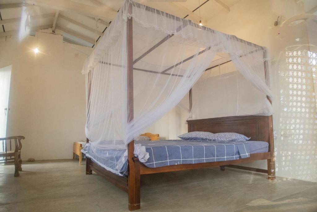 Postel nebo postele na pokoji v ubytování Kodi Beach Home