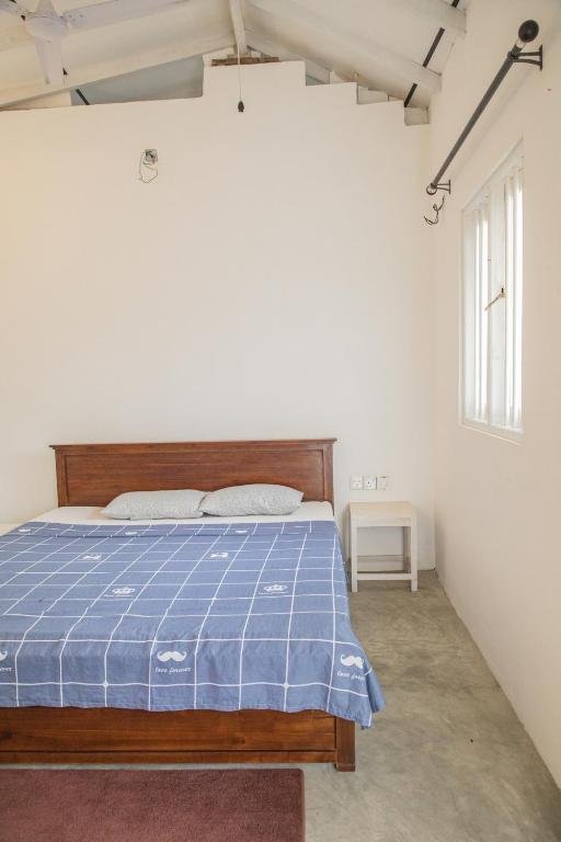 Postel nebo postele na pokoji v ubytování Kodi Beach Home
