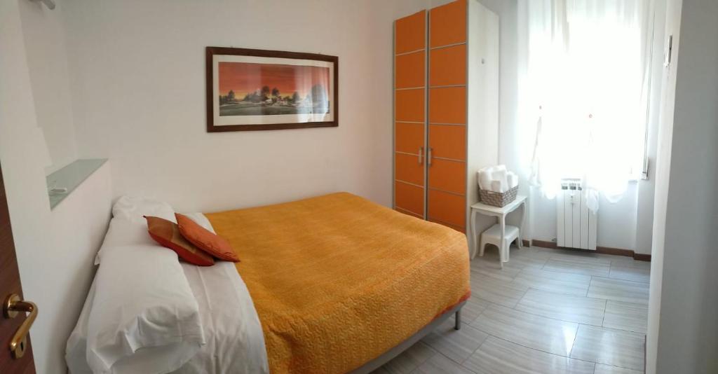 Tempat tidur dalam kamar di La Nena Appartamenti