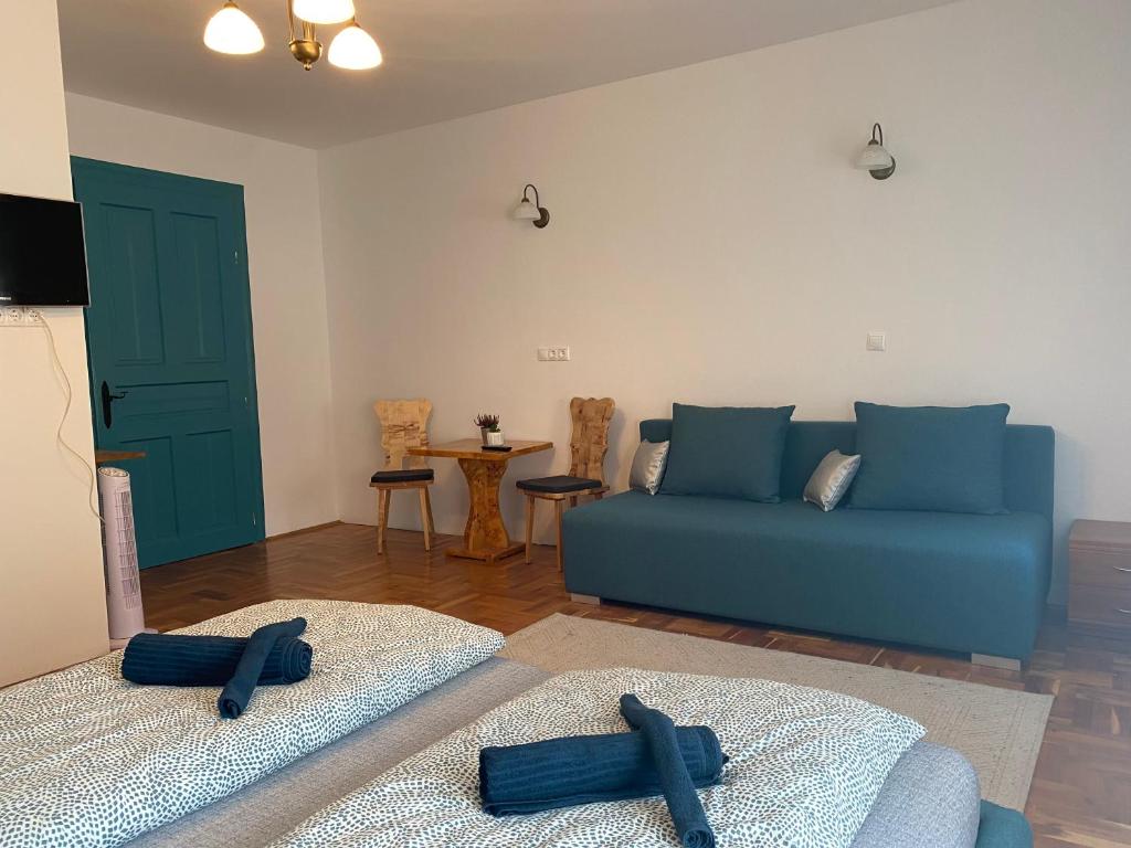 Łóżko lub łóżka w pokoju w obiekcie Balaton7 Apartmanház - Badacsonytomaj Centrum