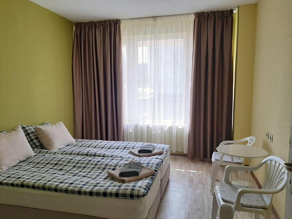 Postel nebo postele na pokoji v ubytování AMADINA Garden