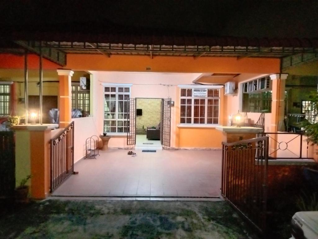 a view of the front of a house at night at ARUWDA Homestay in Ipoh