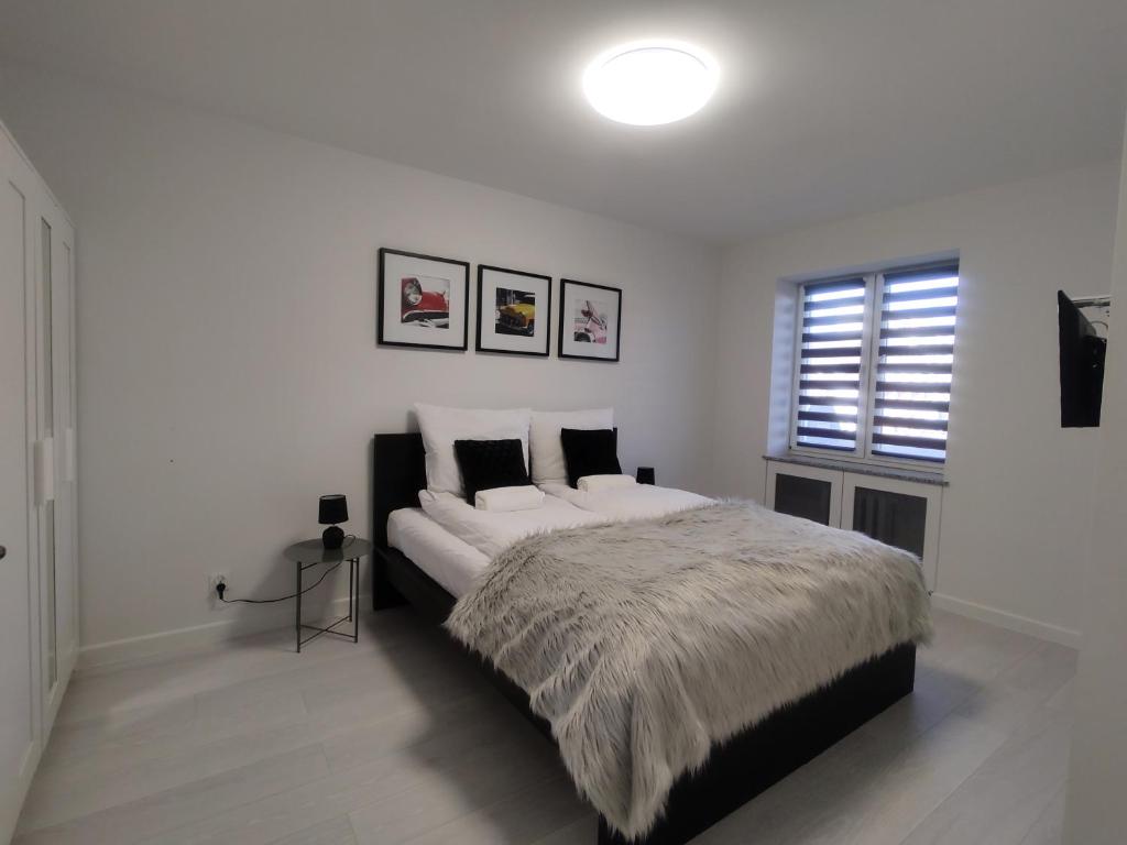 Posteľ alebo postele v izbe v ubytovaní Apartament Wrocław Borowska