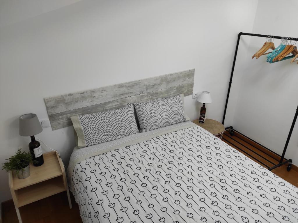 A bed or beds in a room at El Tesoro de Baco