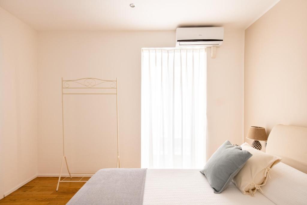 A bed or beds in a room at Moncada Suites & Apartments