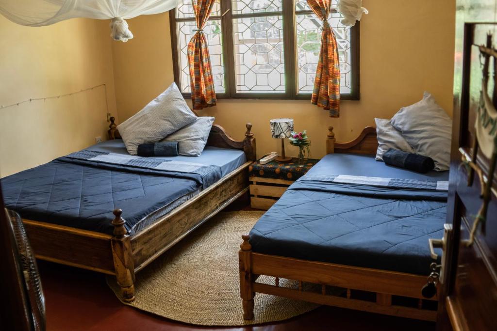 Postel nebo postele na pokoji v ubytování Kiwavi Home