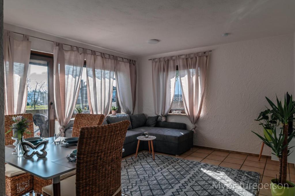 a living room with a couch and a table at Ferienwohnung Elsa in Nideggen