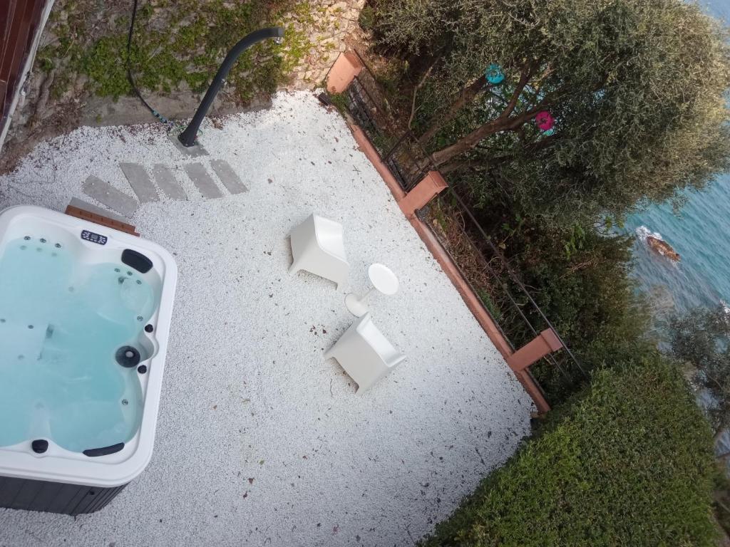 an aerial view of a jacuzzi tub in a yard at Conca Verde c21- BEACH FRONT little villa- POOL, private JACUZZI sea view in Marina dʼAndora