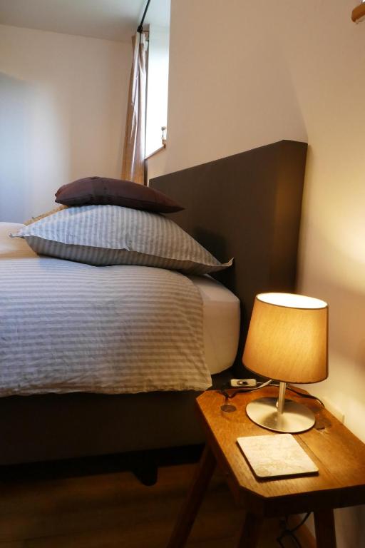 Postel nebo postele na pokoji v ubytování B&B La ferme de Berwausault