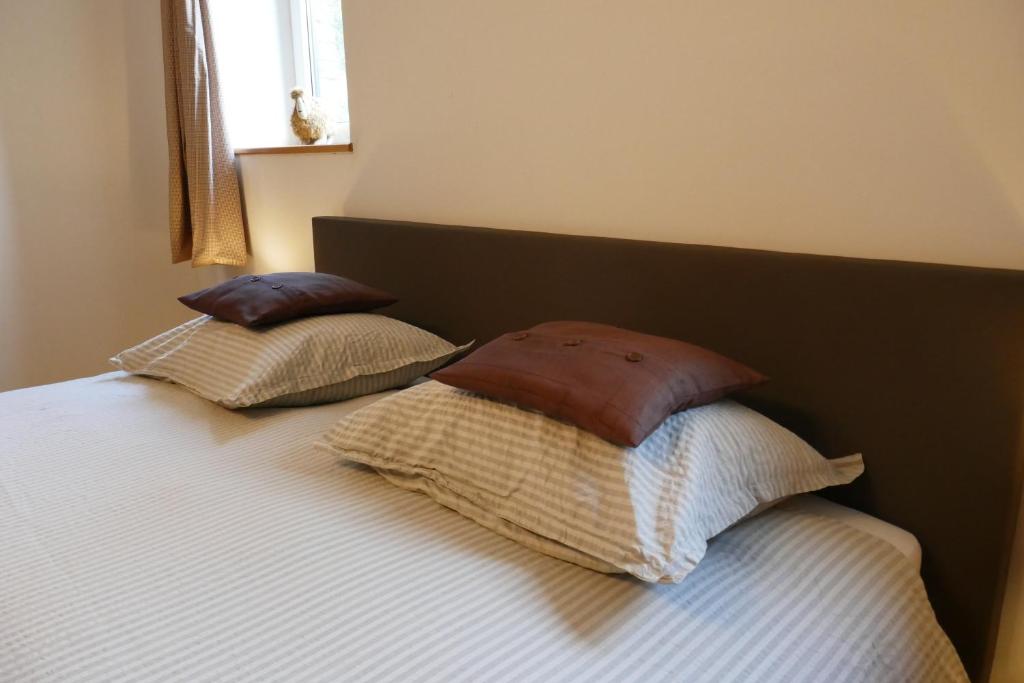 Postel nebo postele na pokoji v ubytování B&B La ferme de Berwausault