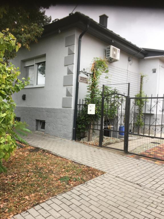 a fence in front of a house at Dombi Porta in Erdőbénye