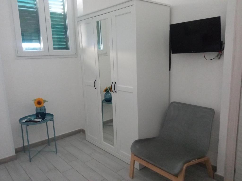Televízia a/alebo spoločenská miestnosť v ubytovaní Domus Linda B&B