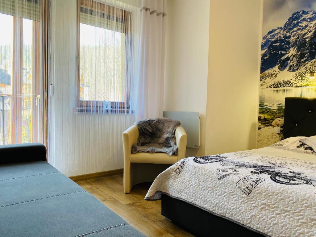 Posteľ alebo postele v izbe v ubytovaní Apartament Rodzinny Gubałówka