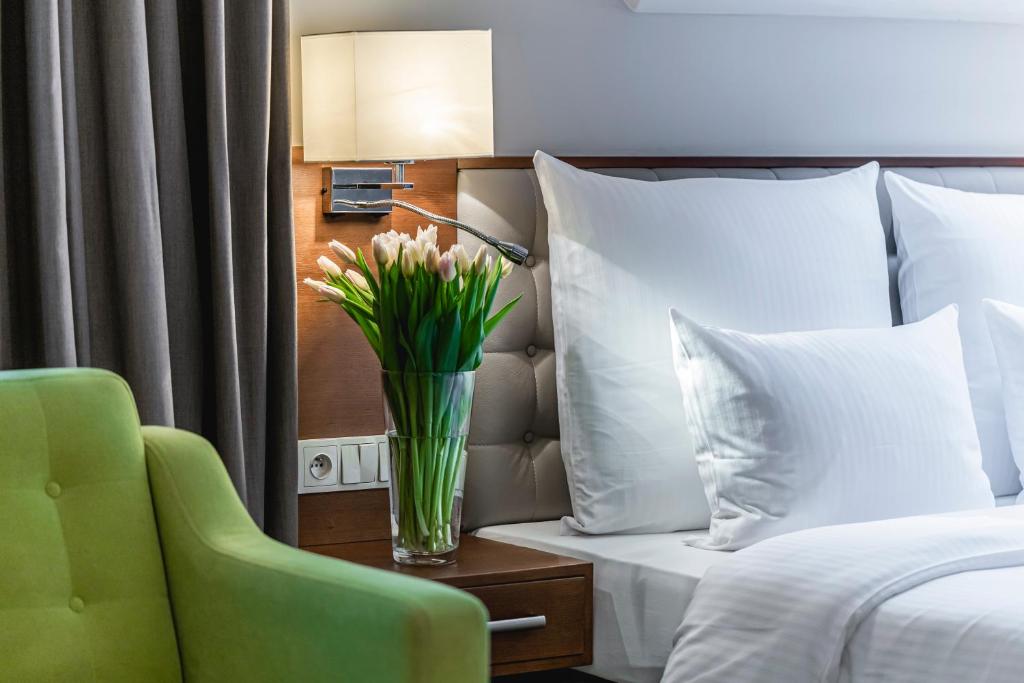 Posteľ alebo postele v izbe v ubytovaní Hotel Wieniawski