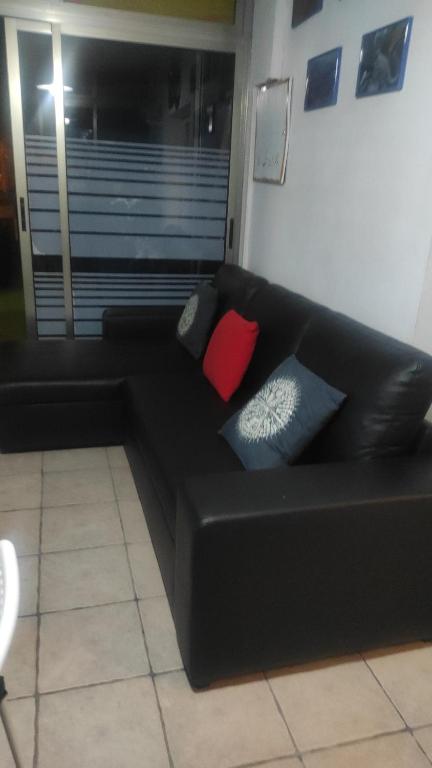 Posedenie v ubytovaní Ático Arinaga con vistas , jacuzzi , terraza y barbacoa