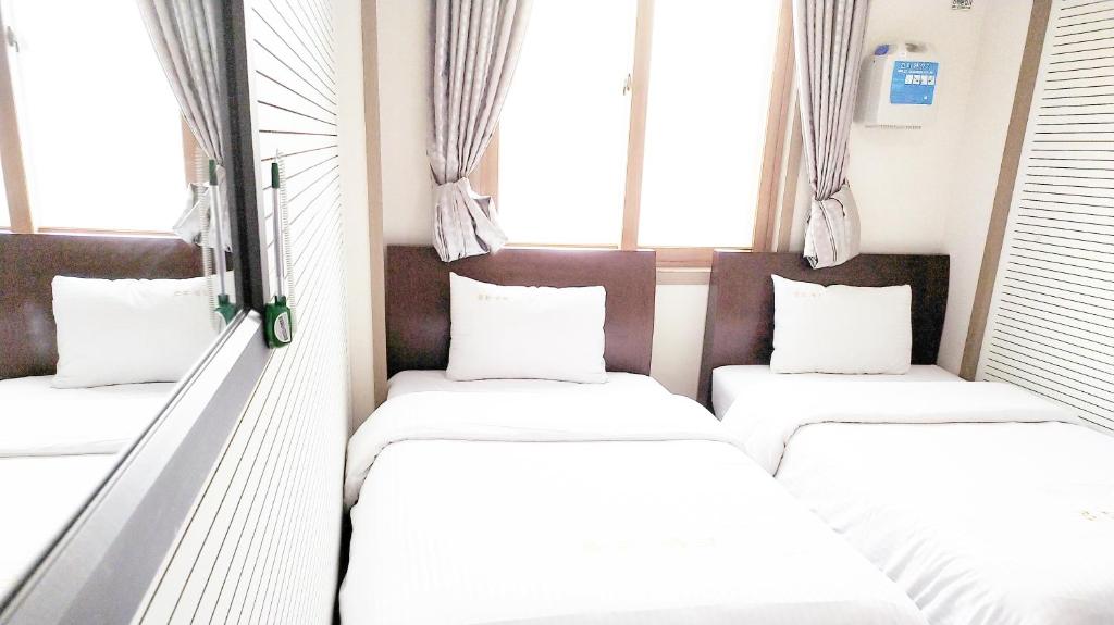 Postel nebo postele na pokoji v ubytování Golden Park Hotel