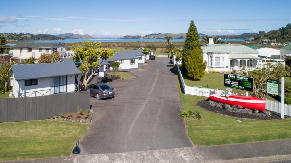 arial view of a street in a residential neighbourhood at Tidewater Motel and Budget Accommodation in Coromandel Town