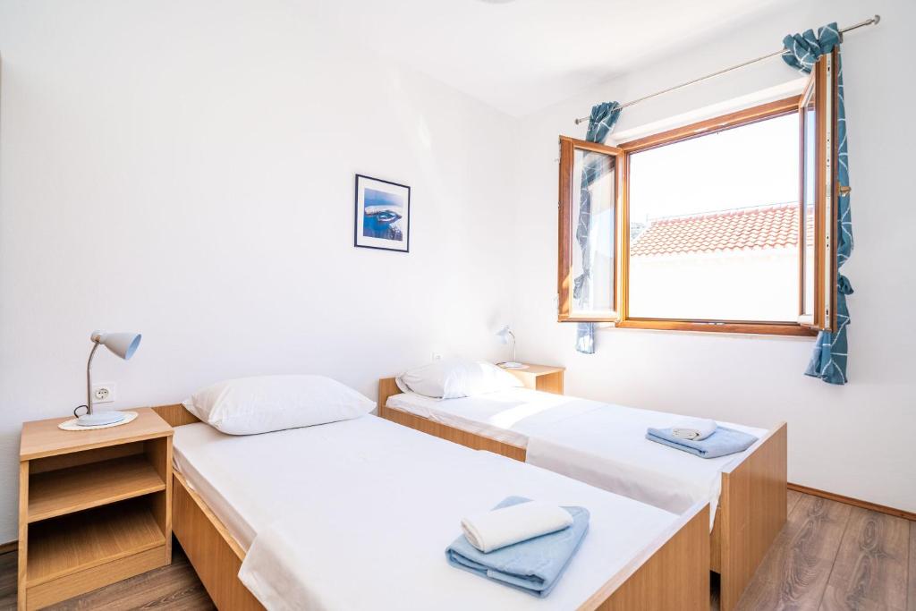 Posteľ alebo postele v izbe v ubytovaní Apartment Bobić