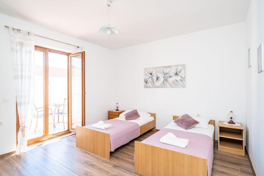 Posteľ alebo postele v izbe v ubytovaní Apartment Bobić