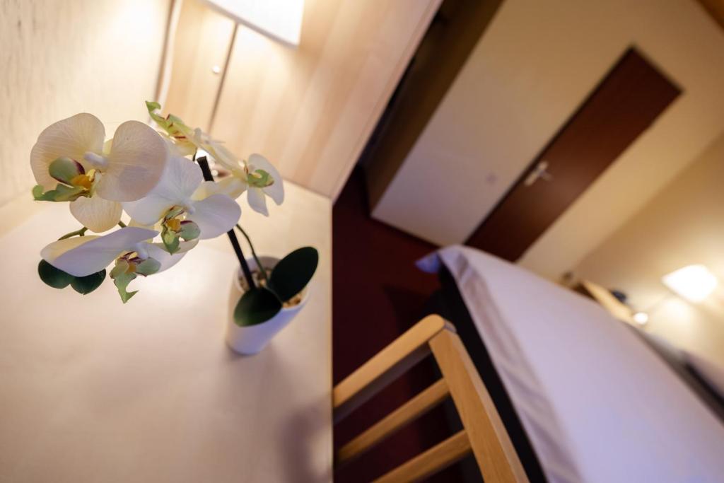Postel nebo postele na pokoji v ubytování Landhotel Ewerts