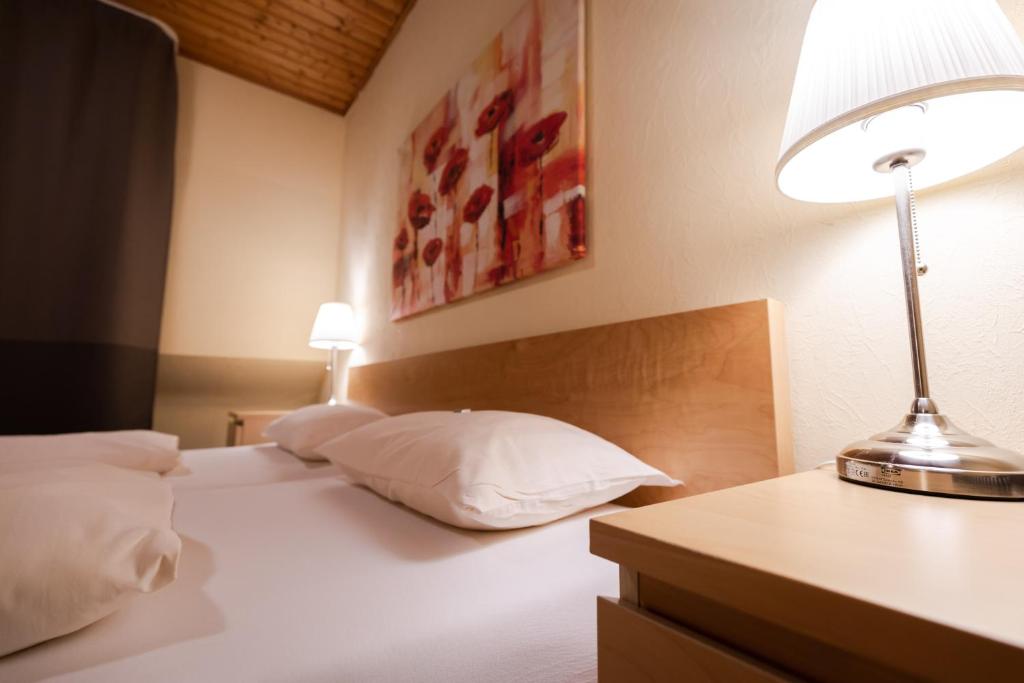 Postel nebo postele na pokoji v ubytování Landhotel Ewerts