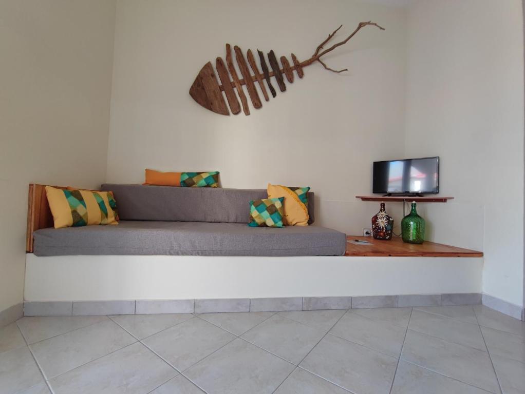 TV a/nebo společenská místnost v ubytování Casa Djarmai Boutique Apartments