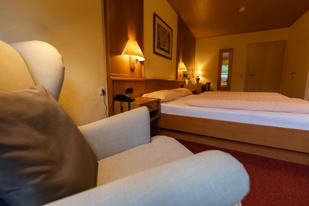 Postel nebo postele na pokoji v ubytování Landhotel Ewerts