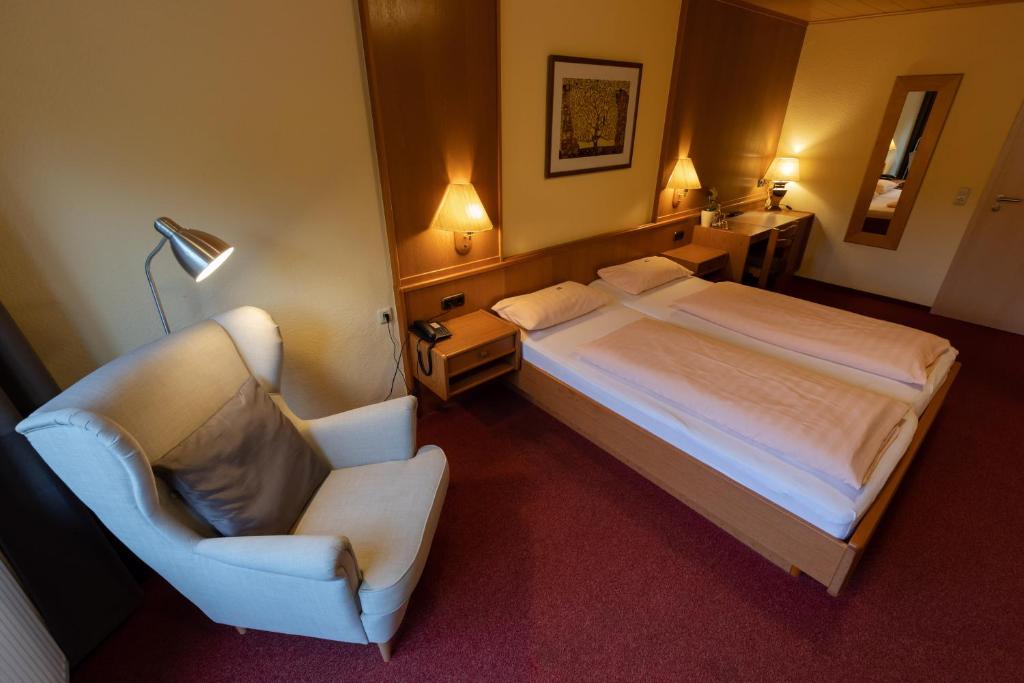 Postel nebo postele na pokoji v ubytování Landhotel Ewerts