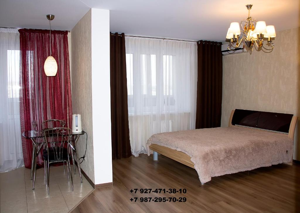 Кровать или кровати в номере Апартаменты Бизнес на Московском Проспекте