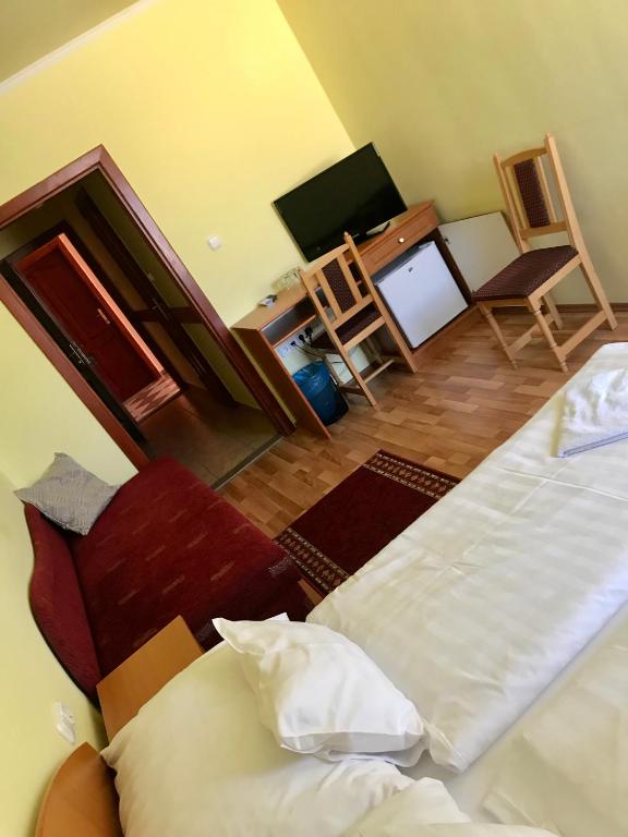 Postel nebo postele na pokoji v ubytování Rábensteiner Panzió