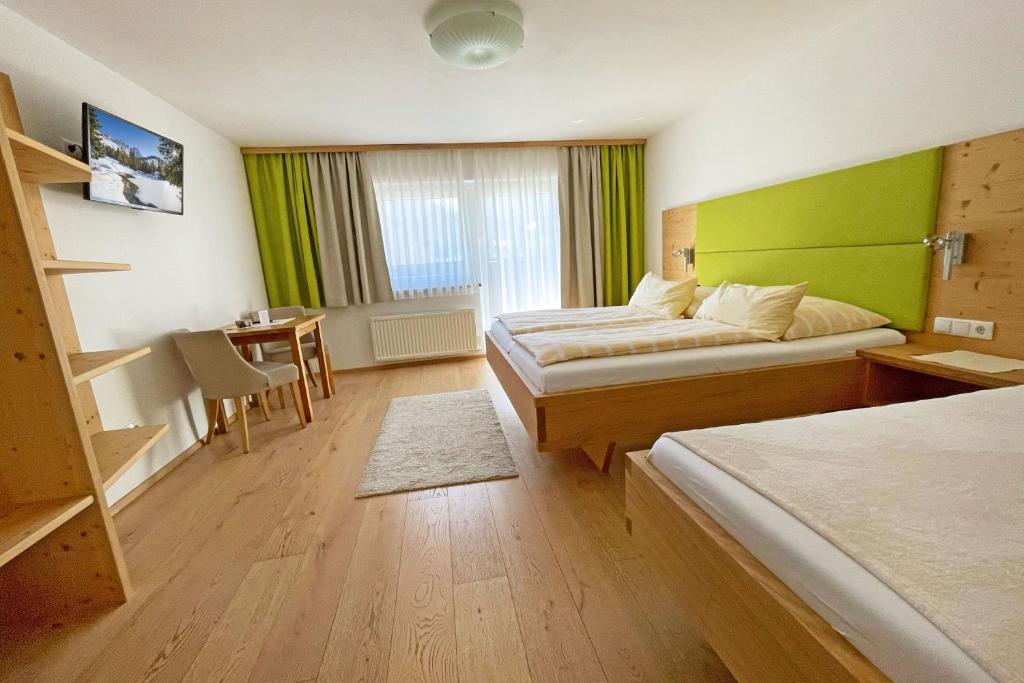 Postel nebo postele na pokoji v ubytování B&B Landhaus Vierthaler