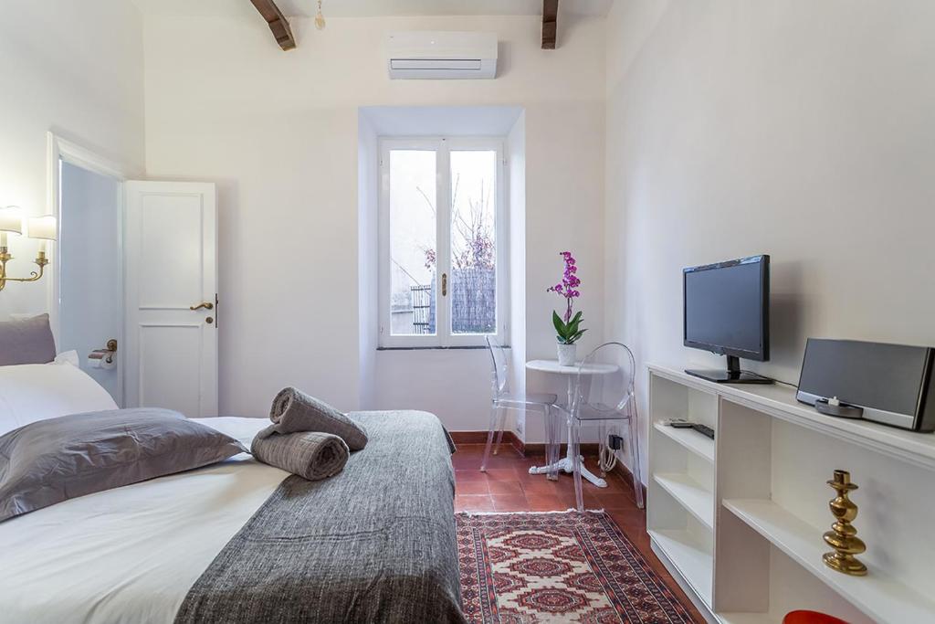 A bed or beds in a room at Sora Menica Twin