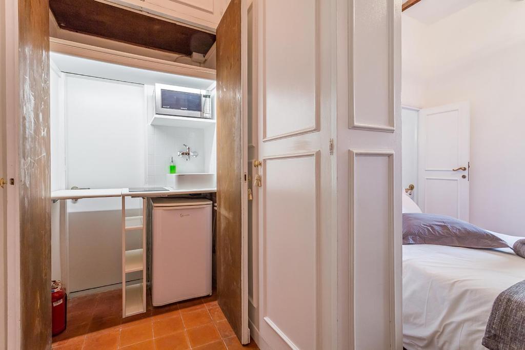 A bed or beds in a room at Sora Menica Twin