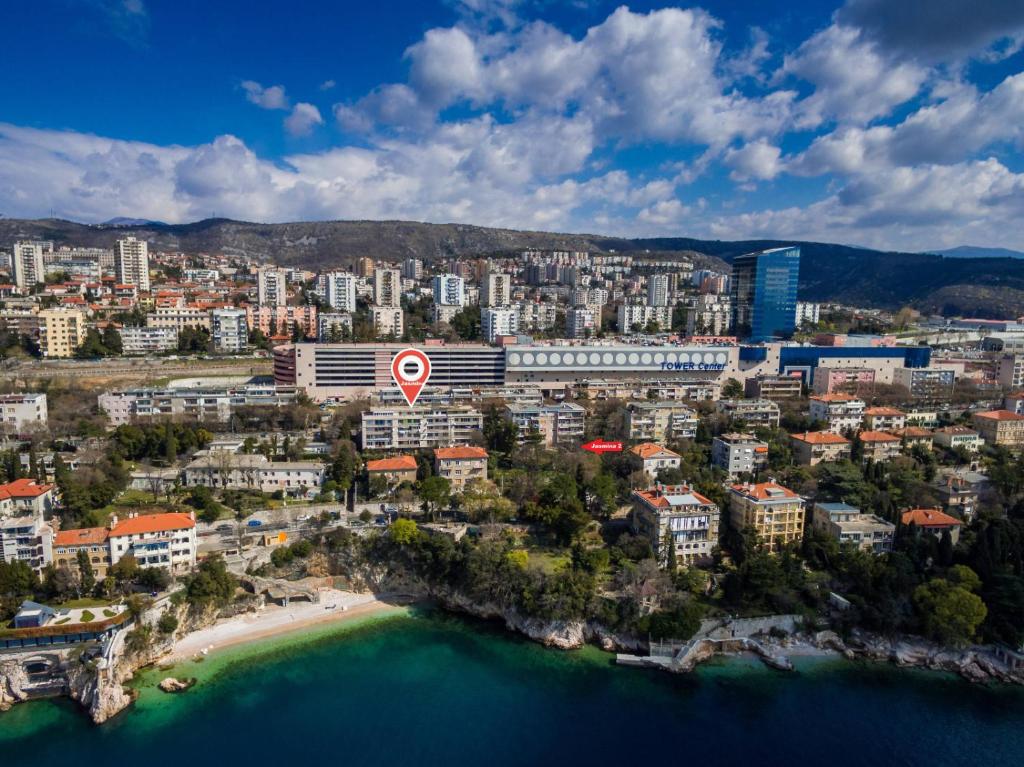 an aerial view of a city with a beach and buildings at Apartman Jasmina 2 in Rijeka